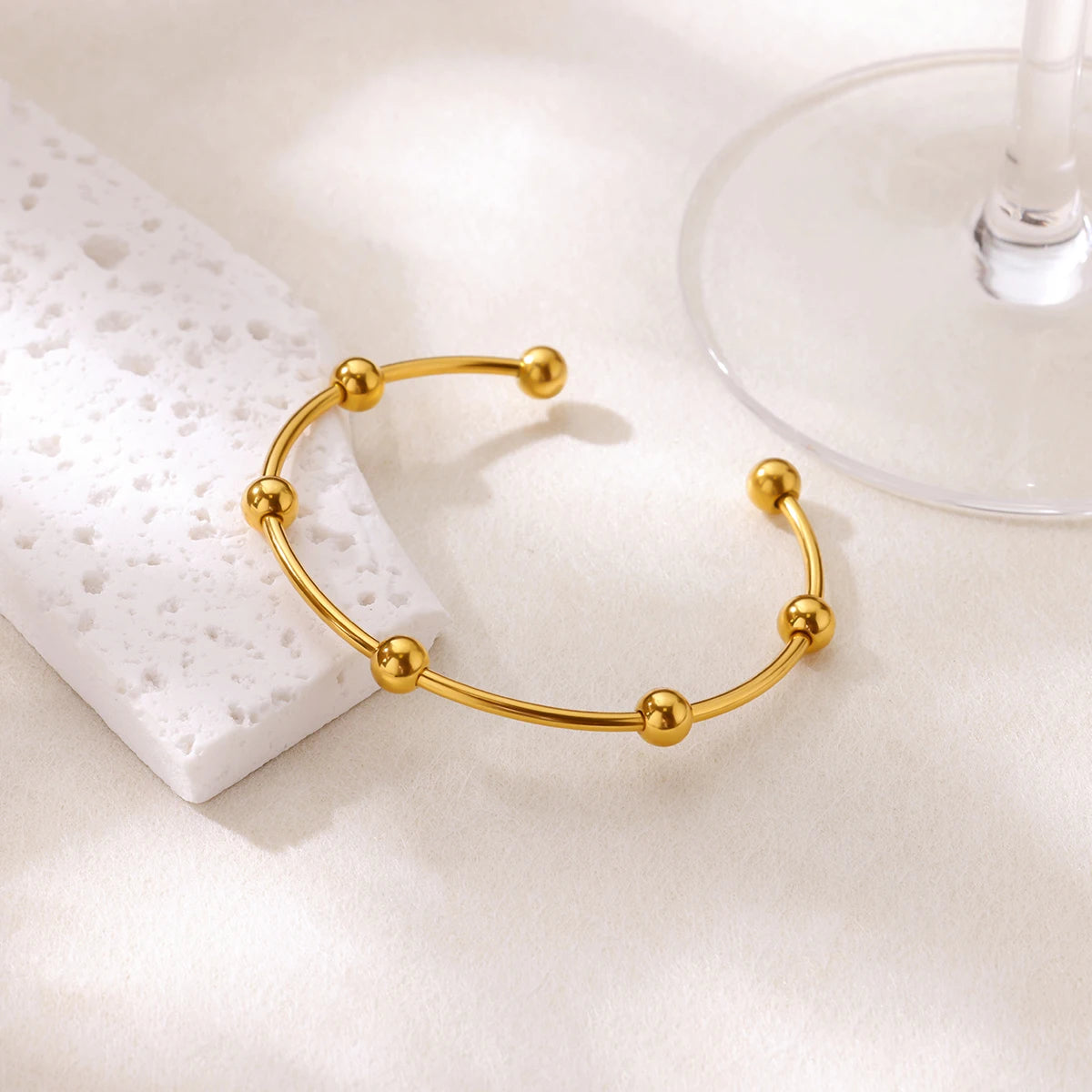 Cuff bangle with floral detail. Chunky or openwork, gold and silver