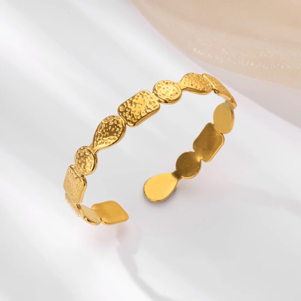Cuff bangle with floral detail. Chunky or openwork, gold and silver