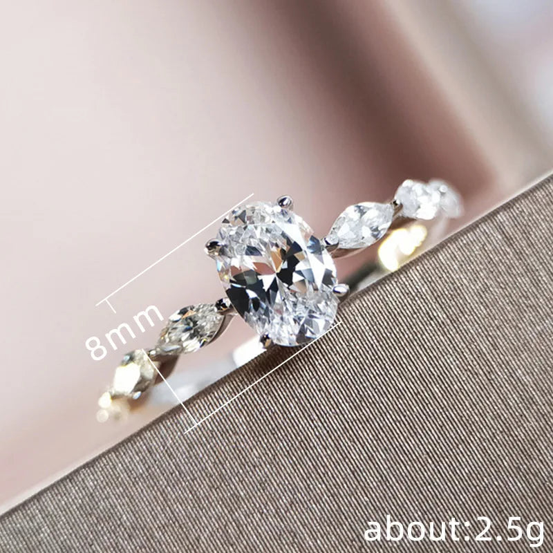 Oval Solitaire Ring, 925 Sterling Silver. Pavé Band
