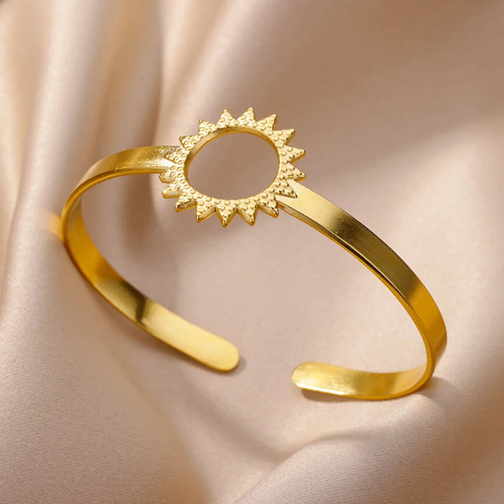 Cuff bangle with floral detail. Chunky or openwork, gold and silver
