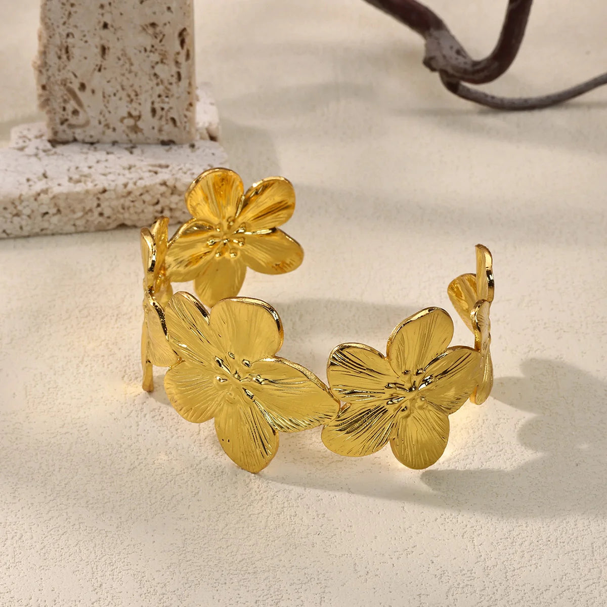 Cuff bangle with floral detail. Chunky or openwork, gold and silver