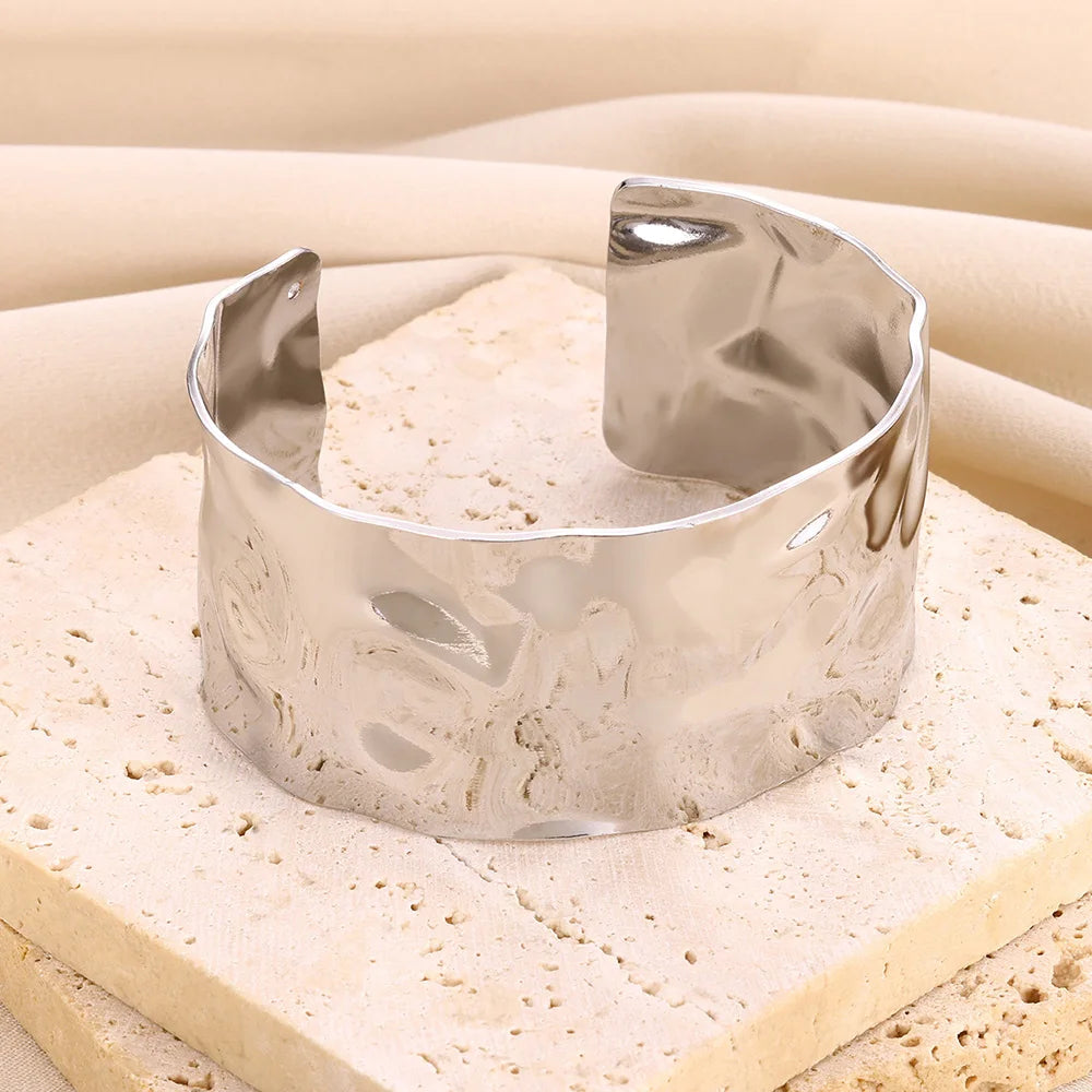 Cuff bangle with floral detail. Chunky or openwork, gold and silver