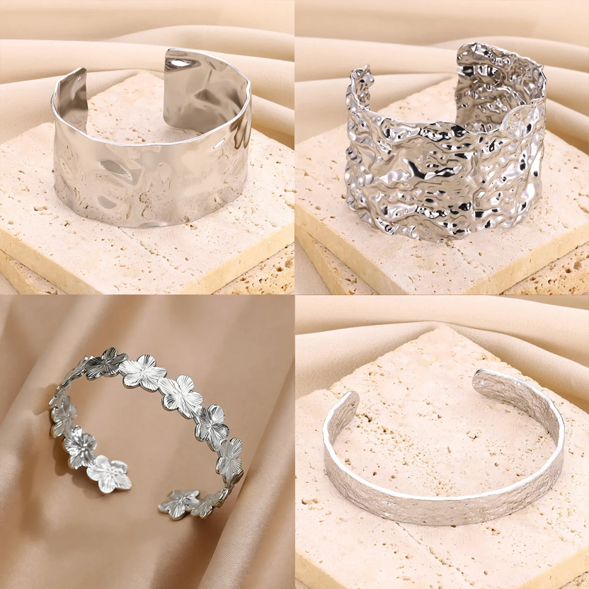 Cuff bangle with floral detail. Chunky or openwork, gold and silver