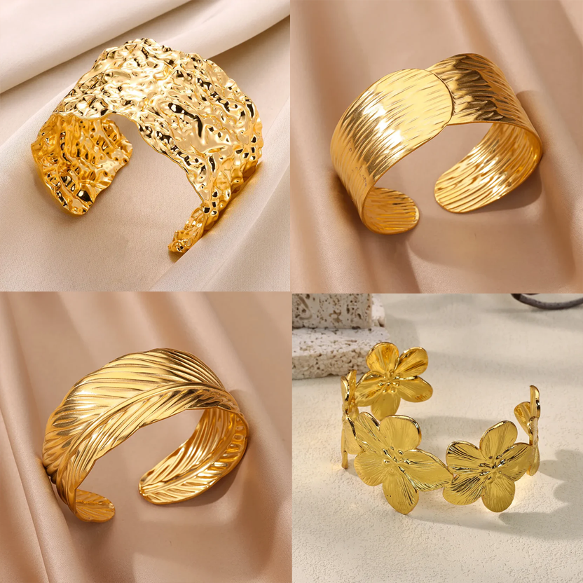 Cuff bangle with floral detail. Chunky or openwork, gold and silver